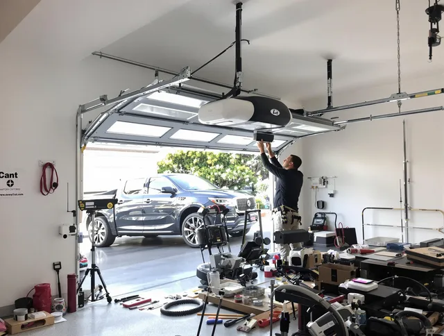 Miramar Garage Door Repair specialist installing smart garage door opener system in Miramar home